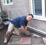 Anthony laying the patio